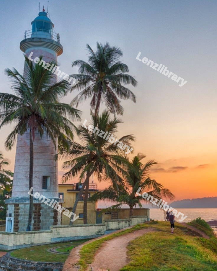 White lighthouse with sunset